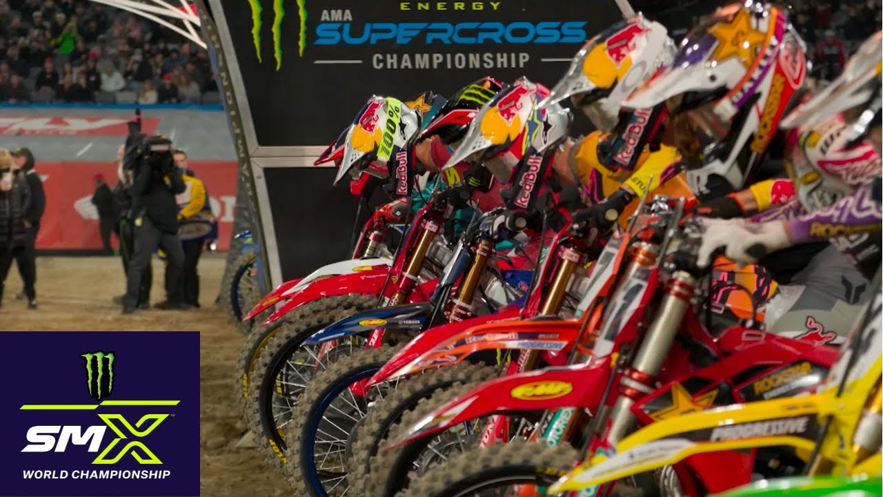 Image of SMX riders getting set for the gate drop with SMX logo in the corner